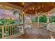 Relaxing covered deck with hammock, offering serene water views at 2127 Lusitania Dr, Sarasota, FL 34231