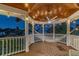 Covered deck with a hammock, offering relaxing waterfront views at 2127 Lusitania Dr, Sarasota, FL 34231