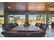 Waterfront dining area with large table and seating for six, offering stunning water views at 2127 Lusitania Dr, Sarasota, FL 34231