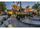 Luxury waterfront home with pool and patio area at dusk at 2127 Lusitania Dr, Sarasota, FL 34231