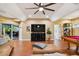 Spacious game room with large TV, comfortable seating, and pool table at 2127 Lusitania Dr, Sarasota, FL 34231