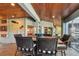 Game room with a dartboard and access to the sunroom at 2127 Lusitania Dr, Sarasota, FL 34231