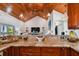 Kitchen with granite island, breakfast bar, and open living area view at 2127 Lusitania Dr, Sarasota, FL 34231