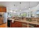 Modern kitchen boasts granite counters, stainless steel appliances, and hardwood floors at 2127 Lusitania Dr, Sarasota, FL 34231