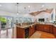 Open kitchen features granite island, wine cooler, and access to deck at 2127 Lusitania Dr, Sarasota, FL 34231