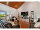 Bright living room with hardwood floors, vaulted ceilings, and a view of the backyard at 2127 Lusitania Dr, Sarasota, FL 34231