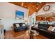 Open living room with hardwood floors, a view of the kitchen, and comfortable seating at 2127 Lusitania Dr, Sarasota, FL 34231