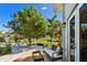 Waterfront patio with comfortable seating and a glass-top coffee table at 2127 Lusitania Dr, Sarasota, FL 34231