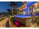 Modern, heated pool with integrated spa at dusk at 2127 Lusitania Dr, Sarasota, FL 34231