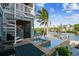 Relaxing pool area with spa and spiral staircase leading to upper deck at 2127 Lusitania Dr, Sarasota, FL 34231