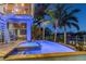 Inviting heated pool and spa with night lighting at 2127 Lusitania Dr, Sarasota, FL 34231