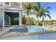 Swimming pool and spa with a spiral staircase nearby at 2127 Lusitania Dr, Sarasota, FL 34231
