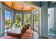 Peaceful porch swing overlooking the water with views of the canal at 2127 Lusitania Dr, Sarasota, FL 34231