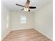 Simple bedroom with wood-look flooring and ceiling fan at 2160 17Th W St, Palmetto, FL 34221