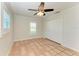 Bright bedroom with tile flooring, ceiling fan, and double closets at 2160 17Th W St, Palmetto, FL 34221