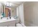 Clean bathroom with white vanity, bathtub, and shower at 3267 Beneva Rd # 103, Sarasota, FL 34232