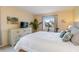 Spacious bedroom with a queen bed and plenty of storage at 3267 Beneva Rd # 103, Sarasota, FL 34232