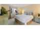 Comfortable bedroom with a queen bed and window views at 3267 Beneva Rd # 103, Sarasota, FL 34232