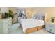 Bedroom with a queen bed, dresser, and exercise bike at 3267 Beneva Rd # 103, Sarasota, FL 34232