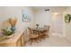 Bright dining area with small table and chairs at 3267 S Beneva Rd # 103, Sarasota, FL 34232