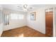 Simple bedroom with hardwood floors and a walk-in closet at 3403 Overcup Oak Ter, Sarasota, FL 34237
