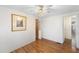 Bright bedroom featuring hardwood floors and a large closet at 3403 Overcup Oak Ter, Sarasota, FL 34237