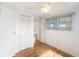 Simple bedroom featuring wood floors and a ceiling fan at 3403 Overcup Oak Ter, Sarasota, FL 34237
