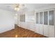 Bright bedroom with wood floors and built-in storage at 3403 Overcup Oak Ter, Sarasota, FL 34237