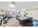 Fitness center with exercise equipment and a pool table at 3403 Overcup Oak Ter, Sarasota, FL 34237
