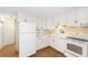 Clean, white kitchen with ample cabinetry and modern appliances at 3403 Overcup Oak Ter, Sarasota, FL 34237