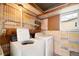 Laundry room with washer and dryer, unique wall decor at 3403 Overcup Oak Ter, Sarasota, FL 34237