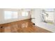 Bright living room with hardwood floors and large windows at 3403 Overcup Oak Ter, Sarasota, FL 34237