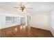 Spacious living room featuring hardwood floors and a ceiling fan at 3403 Overcup Oak Ter, Sarasota, FL 34237