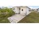 White home exterior with a paved patio area at 3403 Overcup Oak Ter, Sarasota, FL 34237