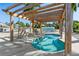 Relaxing spa with wooden pergola and comfortable seating at 3403 Overcup Oak Ter, Sarasota, FL 34237