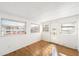 Sunroom with hardwood floors and multiple windows at 3403 Overcup Oak Ter, Sarasota, FL 34237