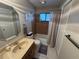 Clean bathroom with tub and shower at 3455 Gardenia St, Sarasota, FL 34237
