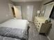 Bright bedroom with a dresser and double bed at 3455 Gardenia St, Sarasota, FL 34237