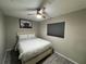 Bright bedroom with ceiling fan and light gray walls at 3455 Gardenia St, Sarasota, FL 34237