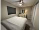 Light and airy bedroom with ceiling fan and dresser at 3455 Gardenia St, Sarasota, FL 34237