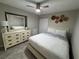 Bedroom with dresser and ceiling fan at 3455 Gardenia St, Sarasota, FL 34237