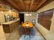 Kitchen with wood-beamed ceiling and a dining area at 3455 Gardenia St, Sarasota, FL 34237
