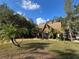 House with a-frame design, surrounded by trees at 3455 Gardenia St, Sarasota, FL 34237