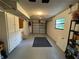 Spacious garage with overhead storage and shelving at 3455 Gardenia St, Sarasota, FL 34237