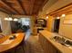Open kitchen with wood cabinets, stone accent wall, and stainless steel appliances at 3455 Gardenia St, Sarasota, FL 34237