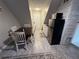 Small kitchenette with microwave, refrigerator, and dining area at 3455 Gardenia St, Sarasota, FL 34237