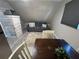 Cozy living room with a sofa and a dining table at 3455 Gardenia St, Sarasota, FL 34237