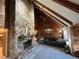 Living room with high ceilings, exposed beams, and a fireplace at 3455 Gardenia St, Sarasota, FL 34237
