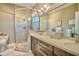 Bathroom features a double vanity, shower, and a modern design at 4003 129Th W St # 101, Cortez, FL 34215