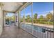 Serene screened porch overlooking pool and tranquil landscape at 4678 Silent Creek Way, Nokomis, FL 34275